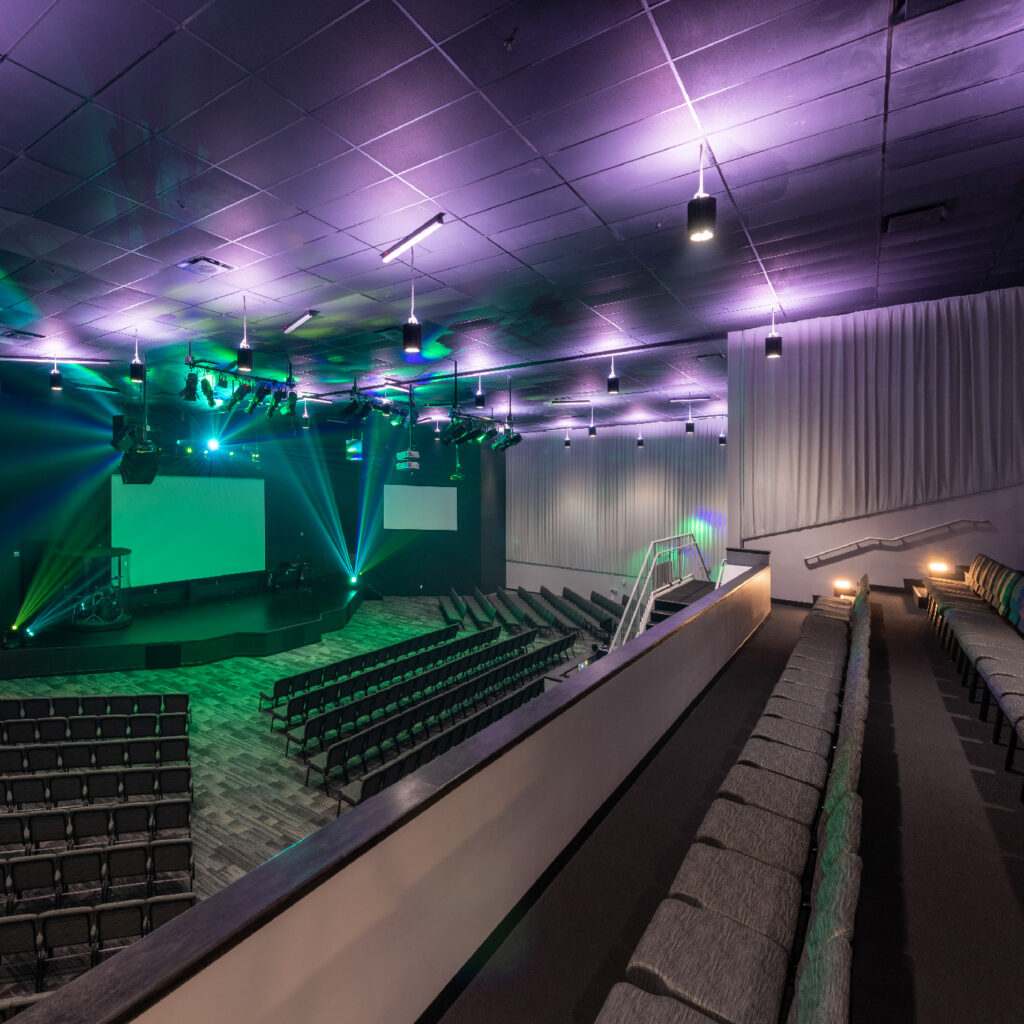 church building design taking two movie theater auditoriums and turned into one large space to be used as the main worship center for thousand hills church in texas